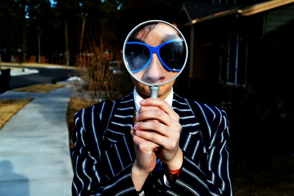Man holding a magnifying glass