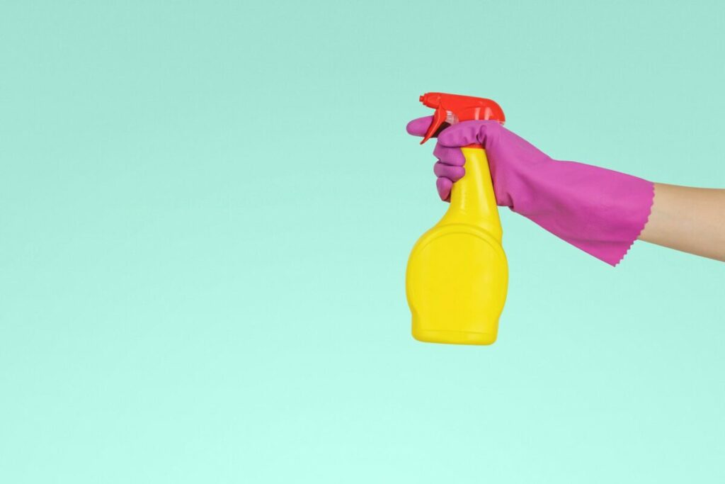 Hand holding a spray bottle